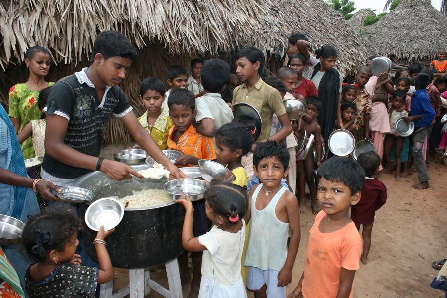 feeding poor child in slums